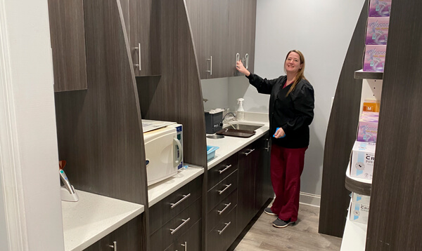 Dr. Babak Ganjavian and hygienist review dental x-ray.